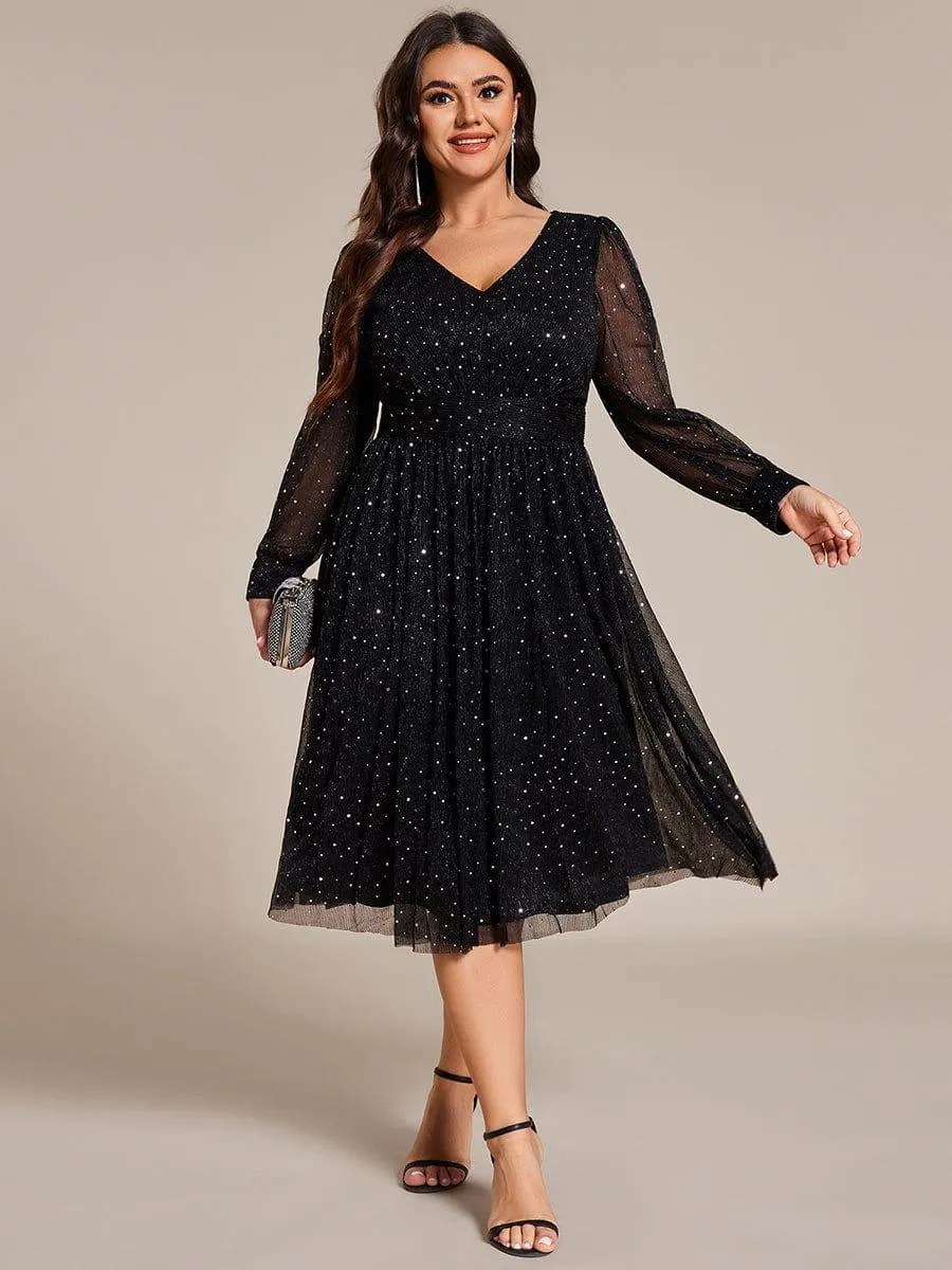 Robe de mariée mi-longue pailletée à manches longues