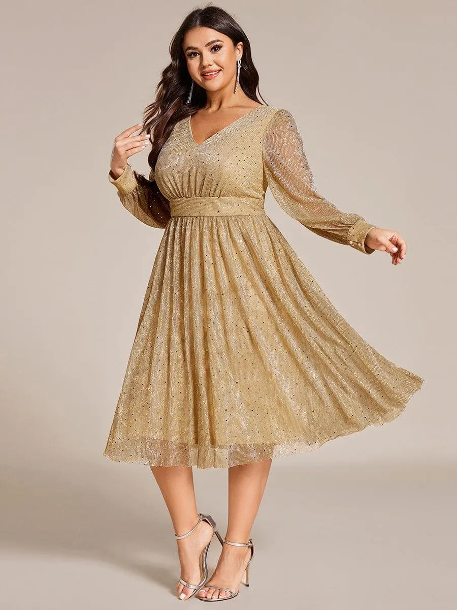 Robe de mariée mi-longue pailletée à manches longues