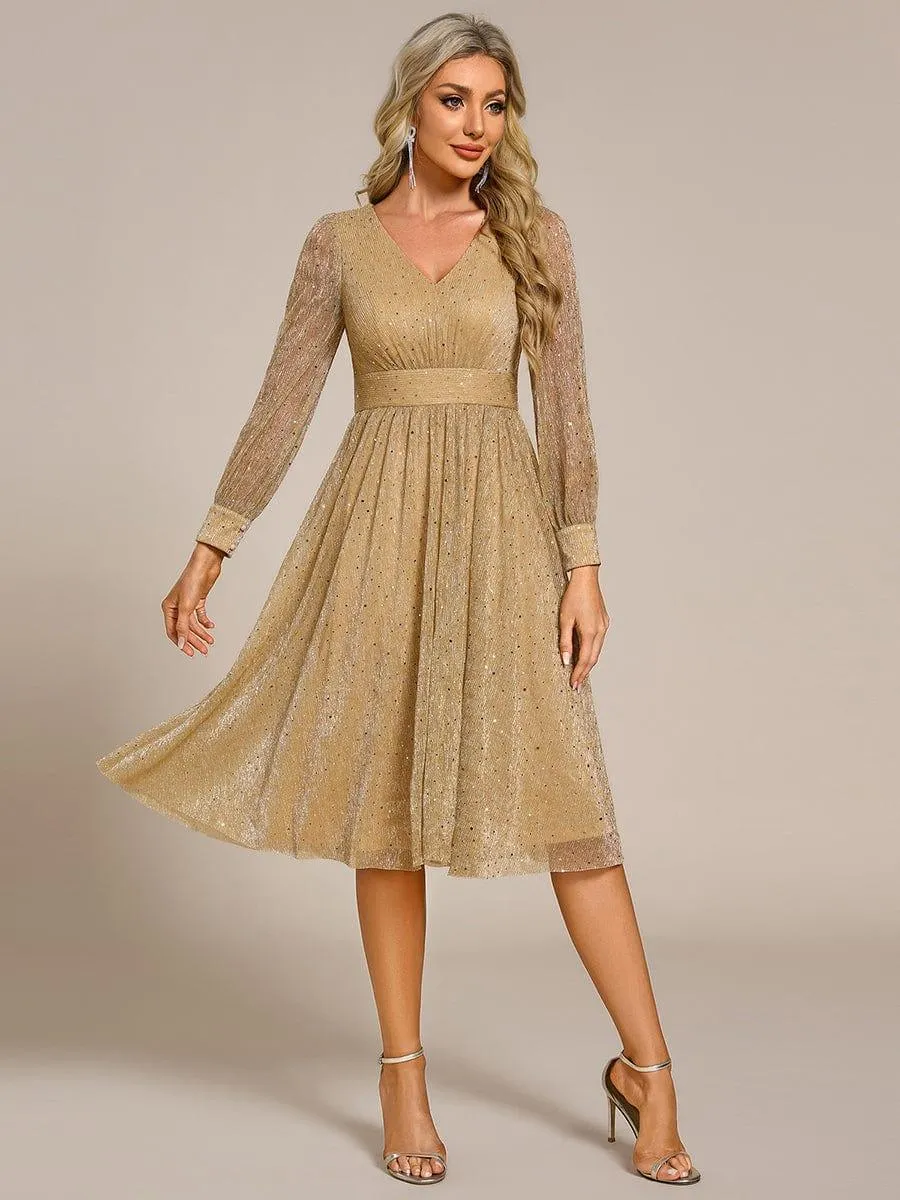 Robe de mariée mi-longue pailletée à manches longues