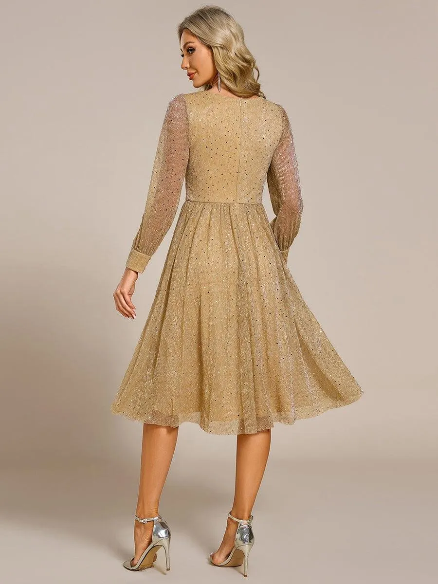 Robe de mariée mi-longue pailletée à manches longues