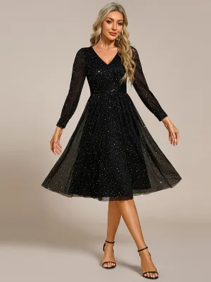 Robe de mariée mi-longue pailletée à manches longues