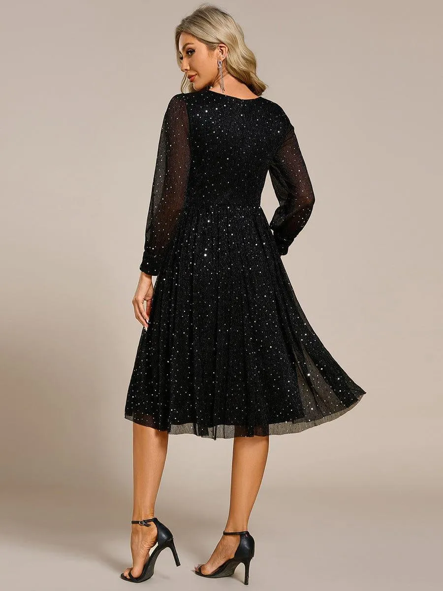 Robe de mariée mi-longue pailletée à manches longues