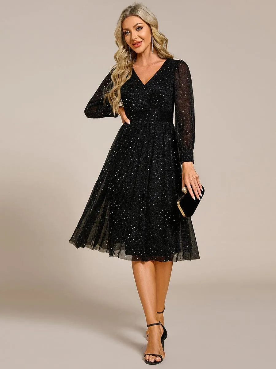 Robe de mariée mi-longue pailletée à manches longues