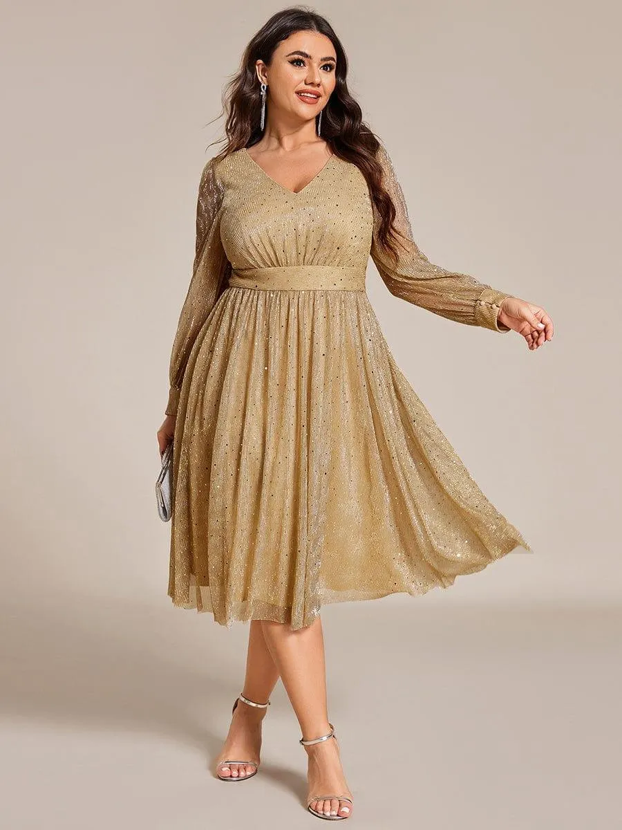 Robe de mariée mi-longue pailletée à manches longues