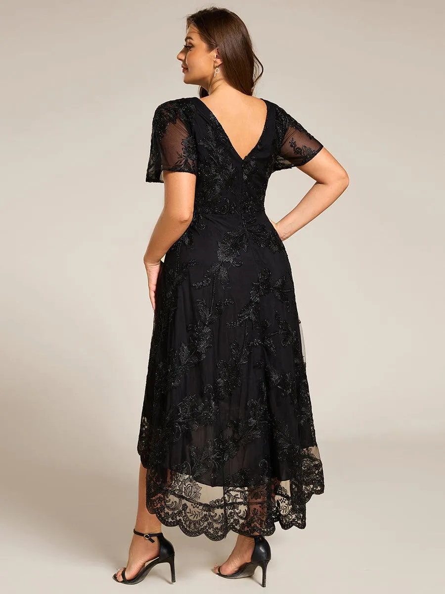 Robe d'invitée de mariage mi-longue à col en V et en maille brodée grande taille