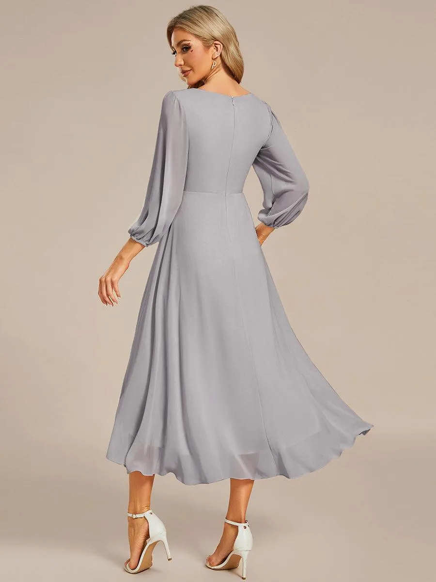 Robe invité de mariage mi-longue manches longues ourlet asymétrique