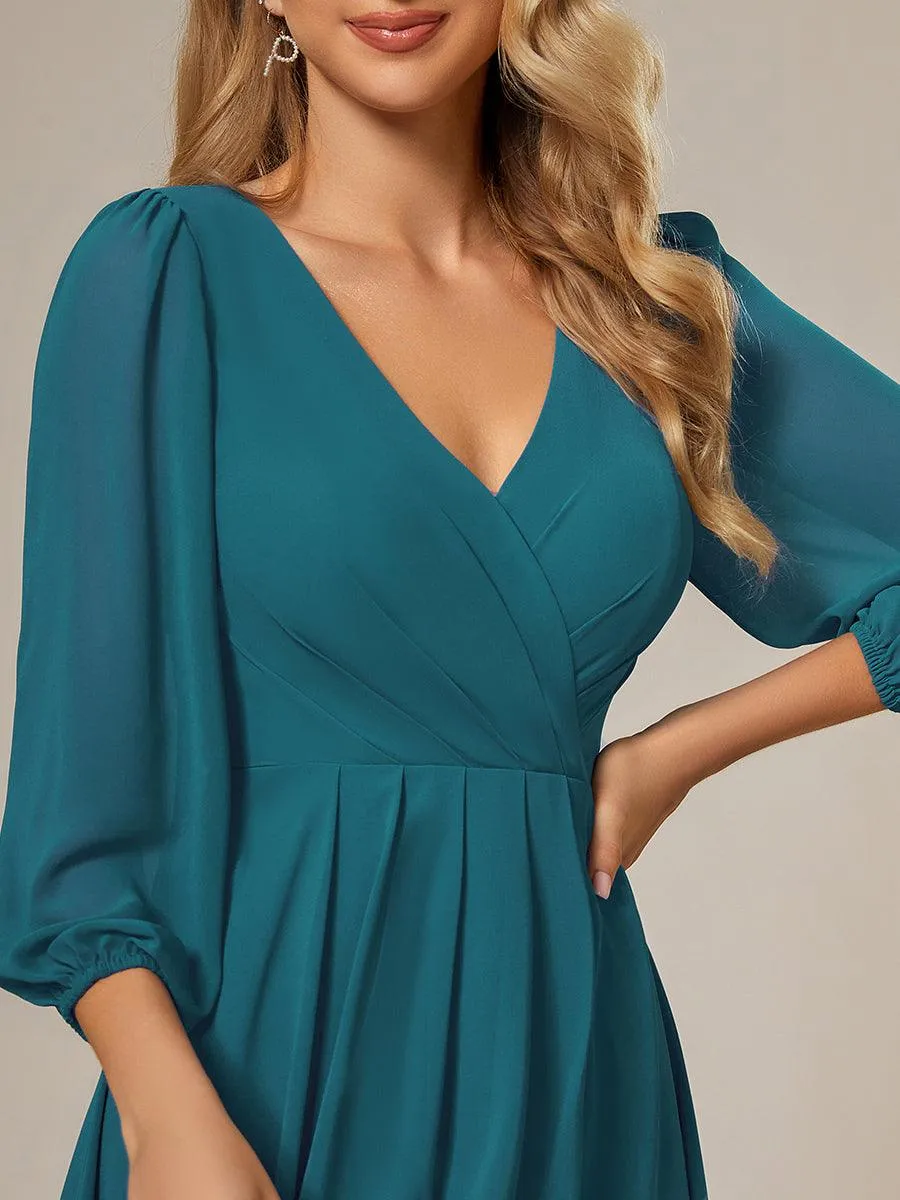 Robe invité de mariage mi-longue manches longues ourlet asymétrique