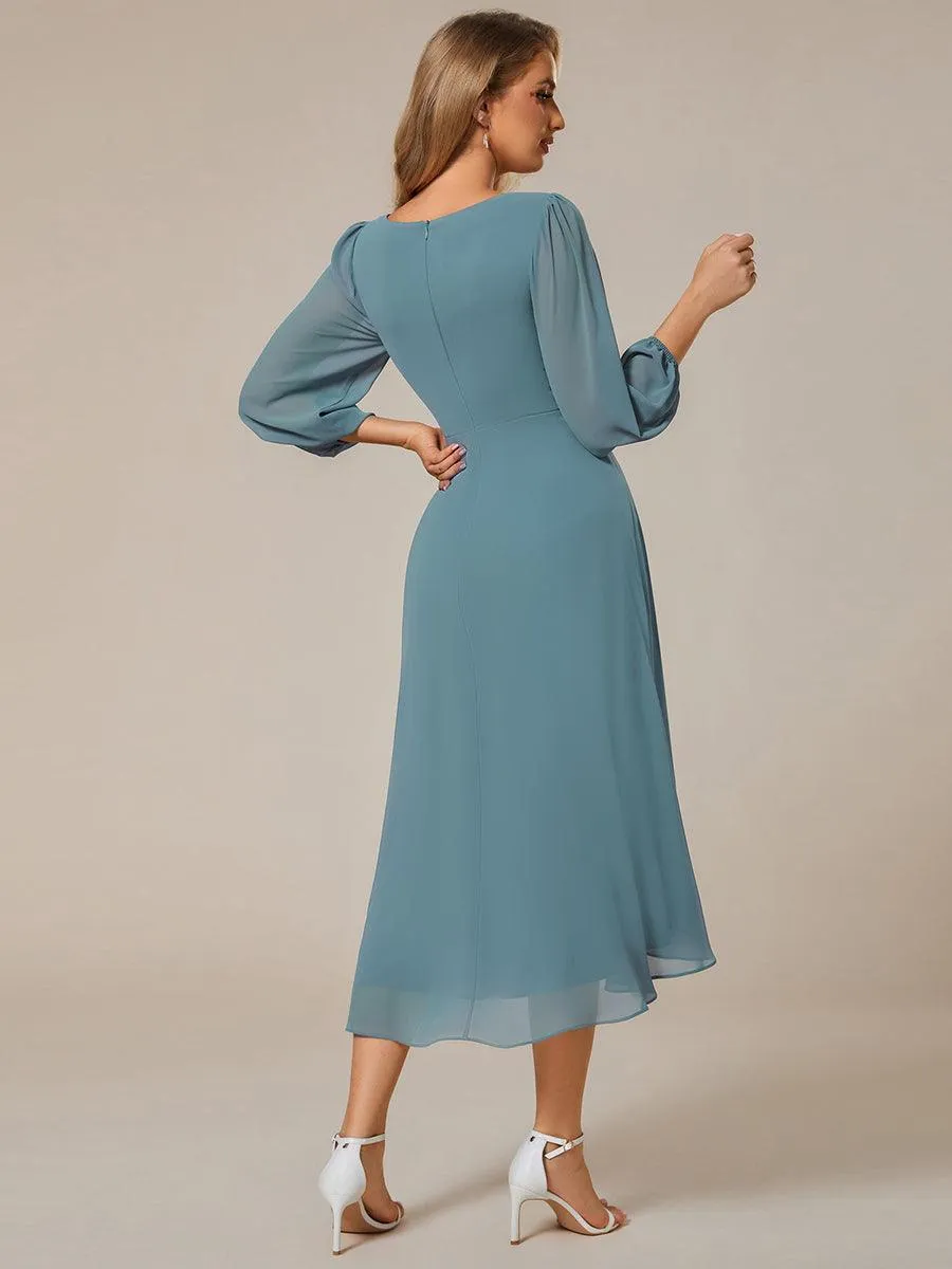 Robe invité de mariage mi-longue manches longues ourlet asymétrique