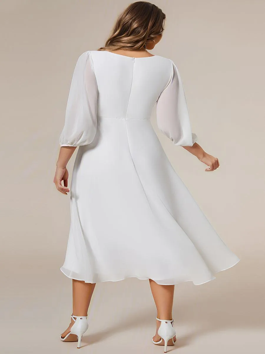 Robe invité de mariage mi-longue manches longues ourlet asymétrique