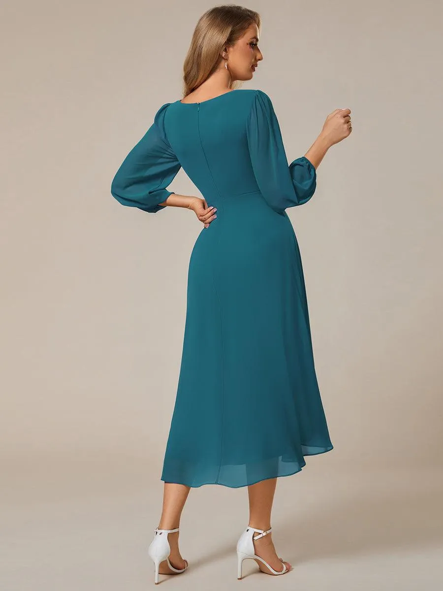 Robe invité de mariage mi-longue manches longues ourlet asymétrique