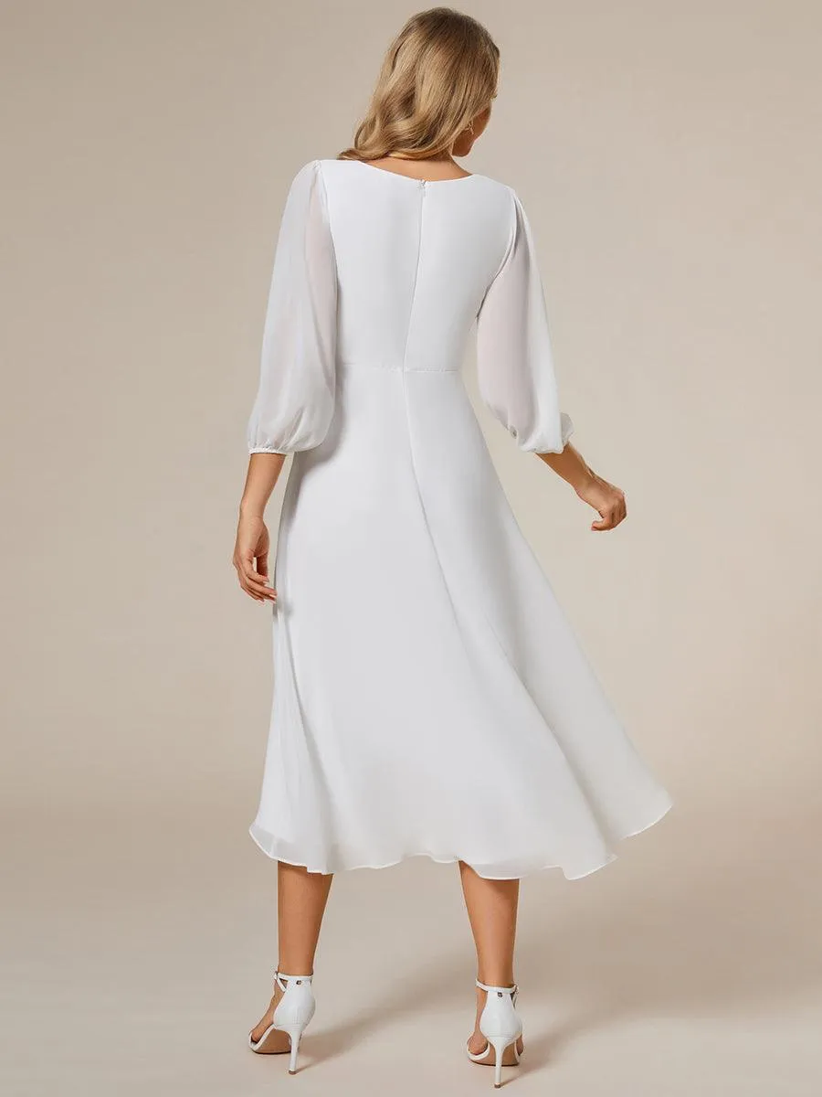 Robe invité de mariage mi-longue manches longues ourlet asymétrique
