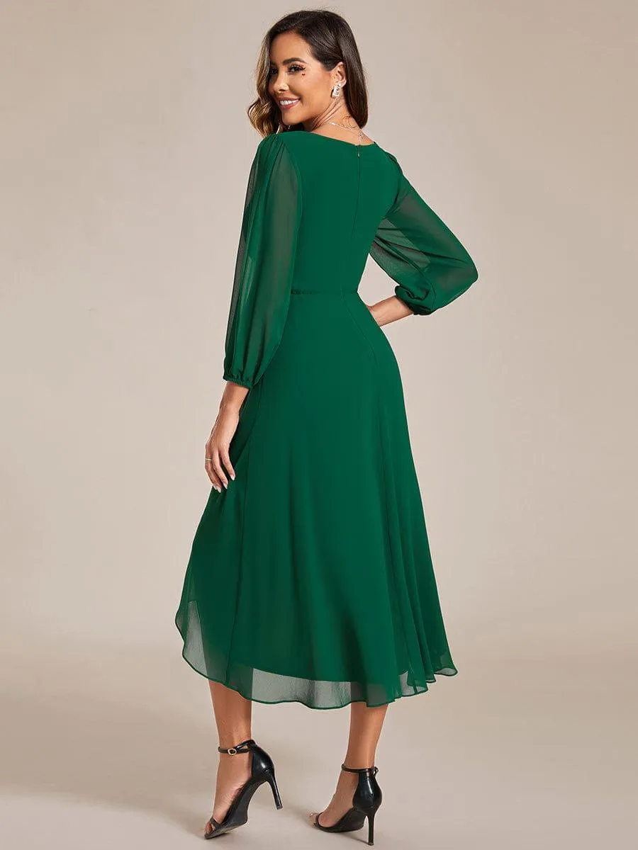 Robe invité de mariage mi-longue manches longues ourlet asymétrique